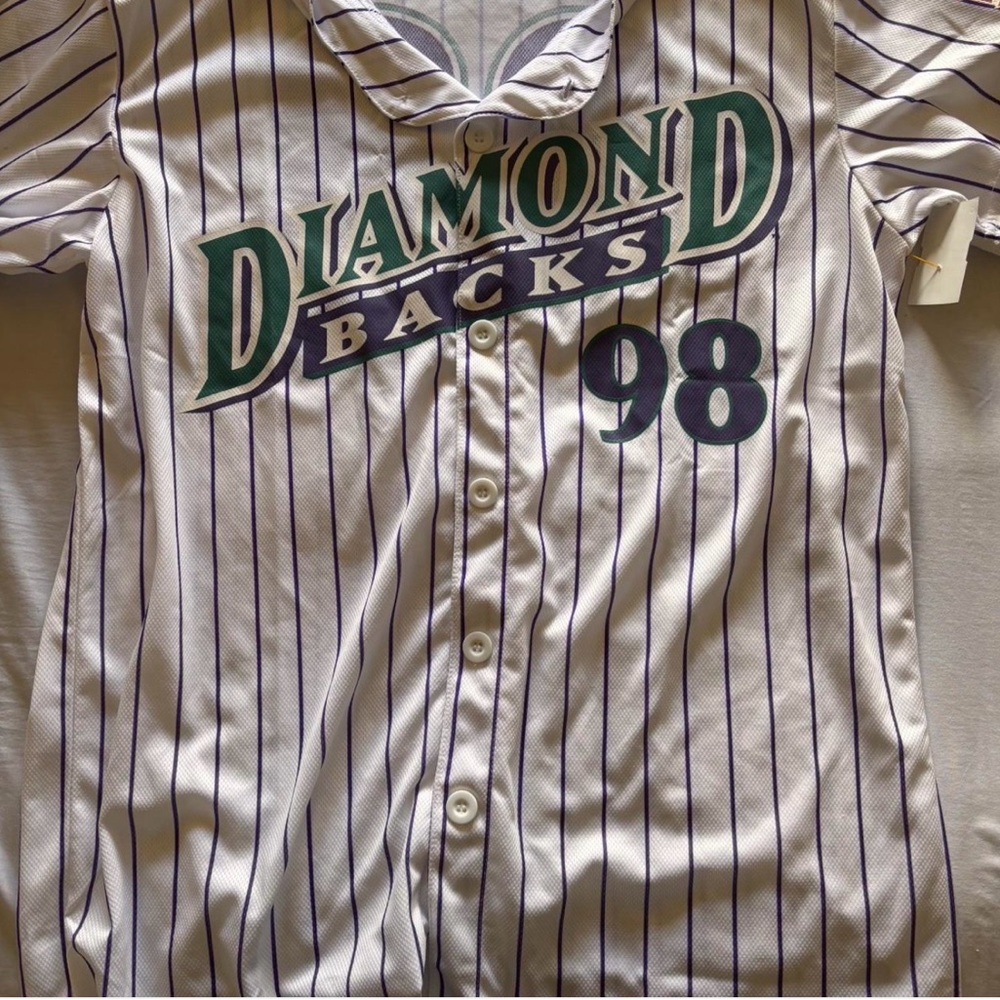 Chaser White and Purple Striped Jersey

Size medium